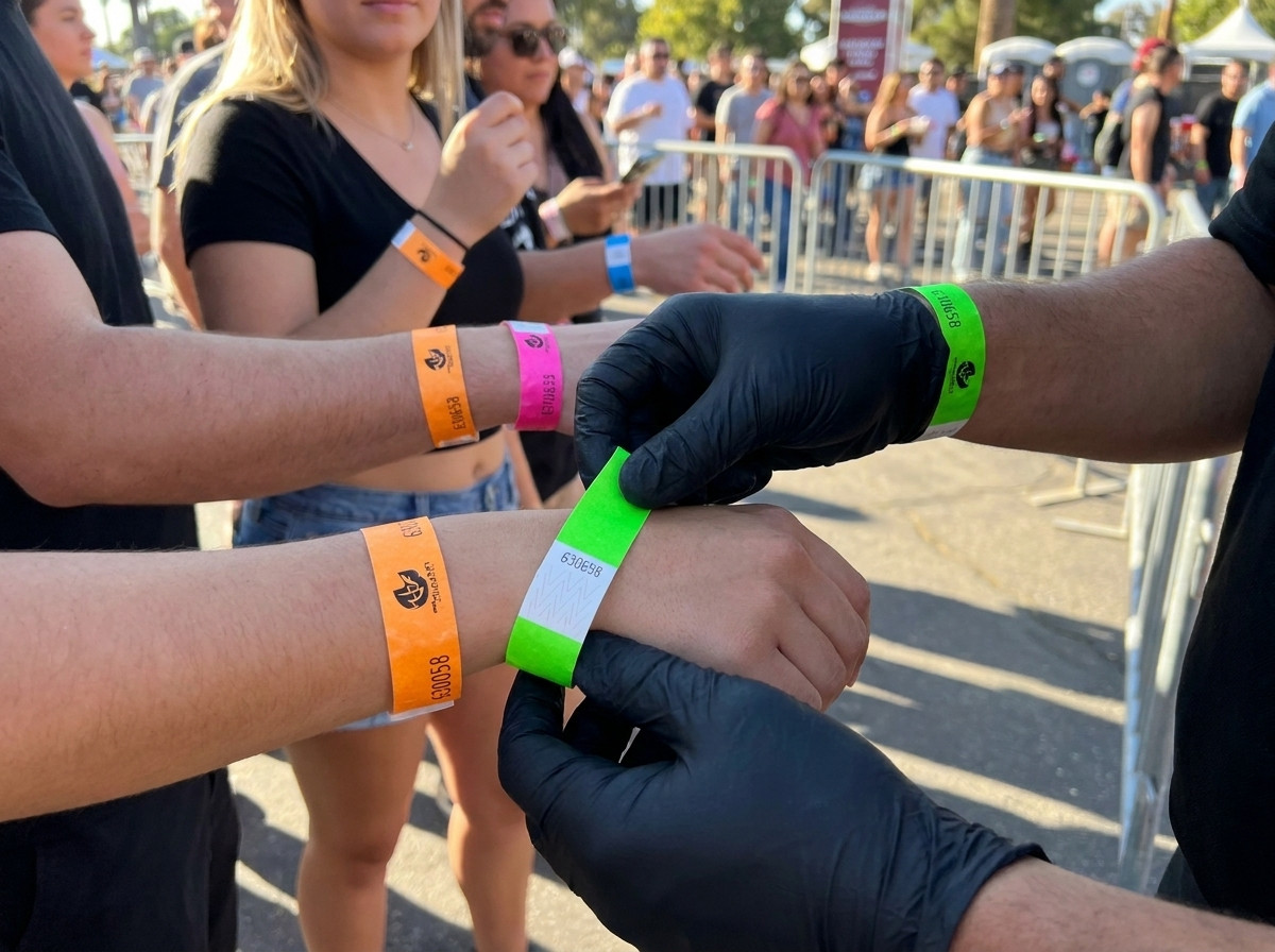 Security officer checking colourful wristbands at the event access point