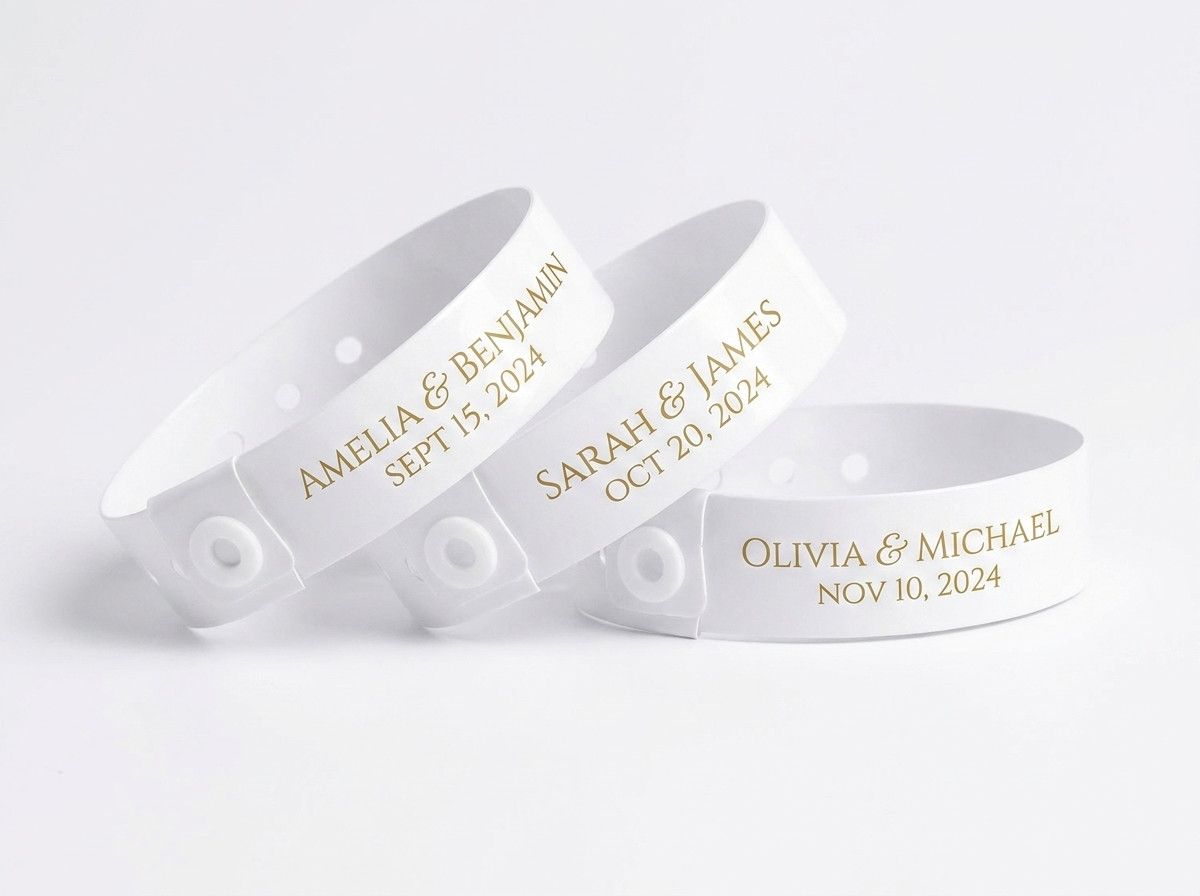 Personalised wedding wristbands with names and date in gold on an elegant white background